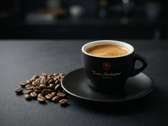 Italian Cappuccino Black cup with espresso and saucer on a dark surface with coffee beans, featuring Lamborghini Coffee branding.