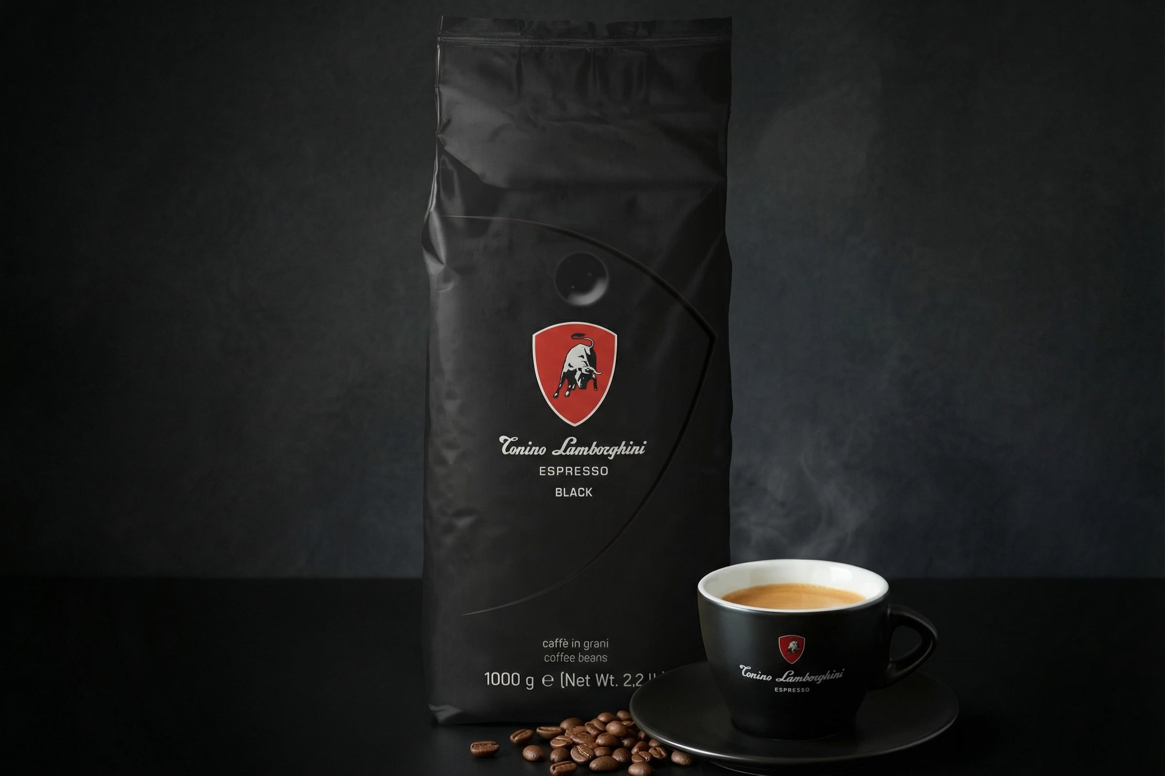 tonino Lamborghini beans - black blend with a cup of coffee on a dark background